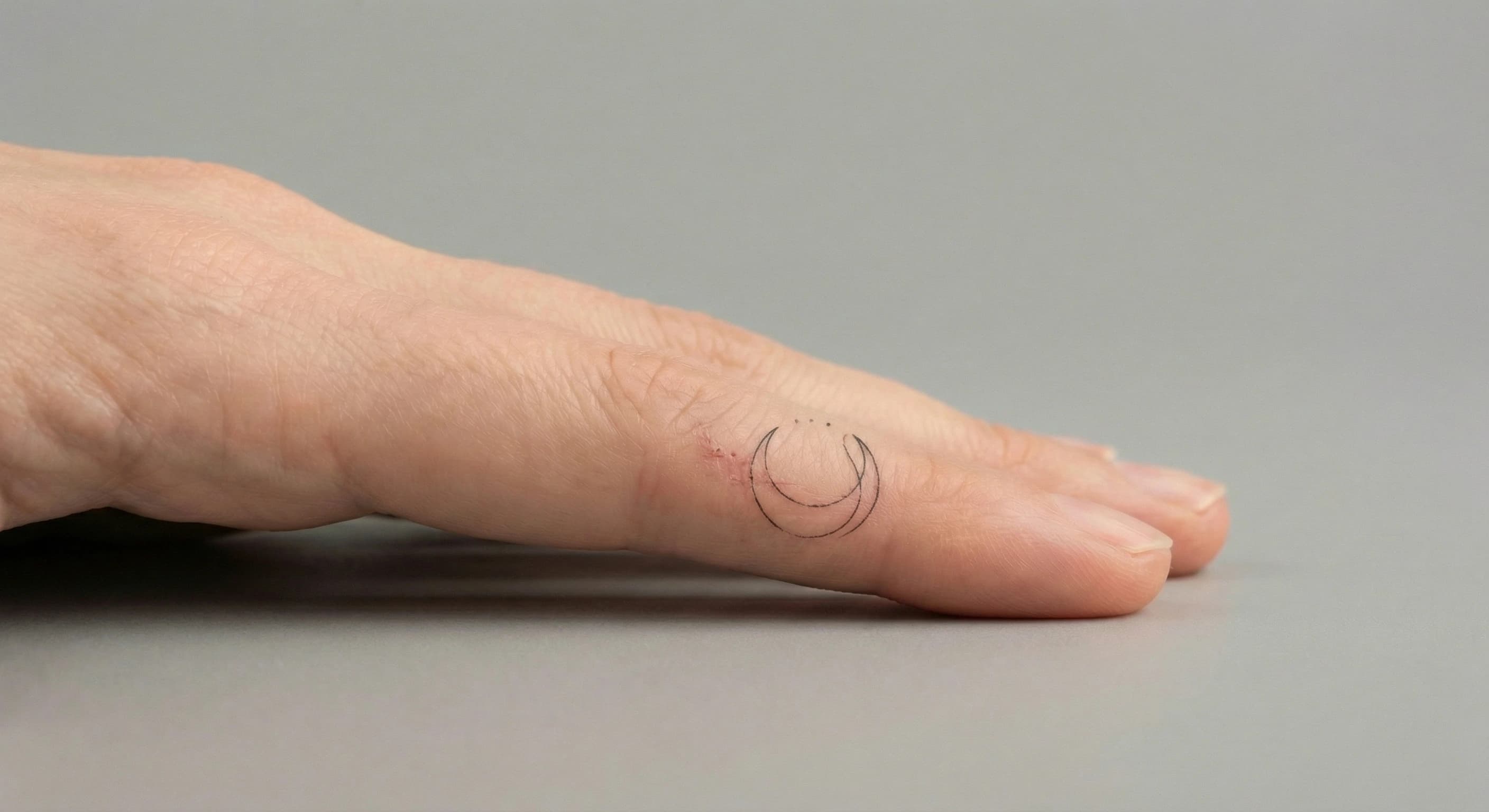 Line Moon Good Fine line Moon Finger Tattoo | InkPatterns